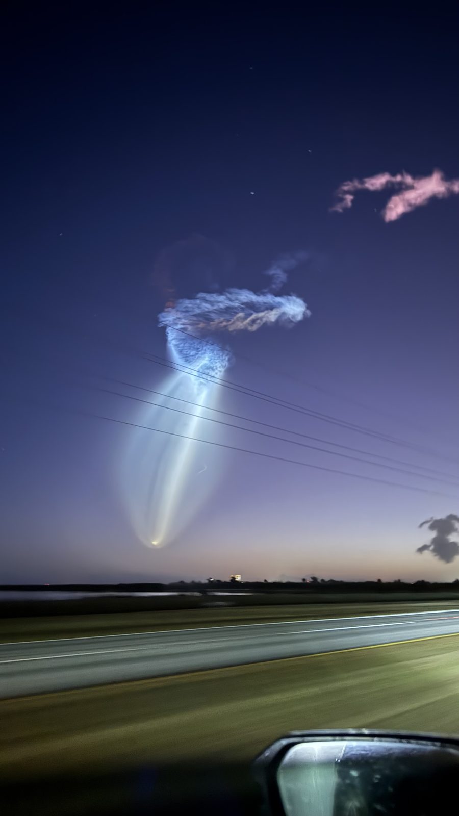 A launch lighting up the sky on an early drive into work