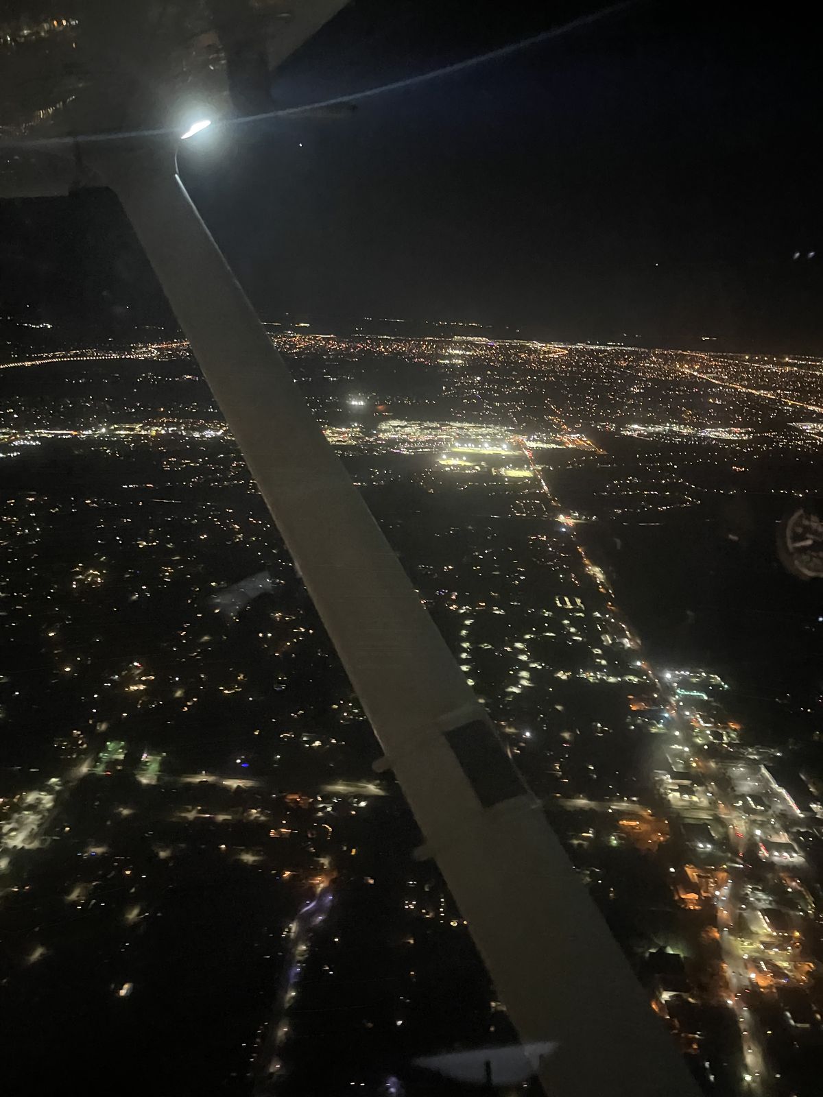 City lights under the wing